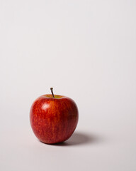 Fresh red apple isolated on white background. Long shot of apples by the rule of third composition. Full depth of field. Ripe apples are ready to eat. Apple wallpaper. Side shot. Healthy food.