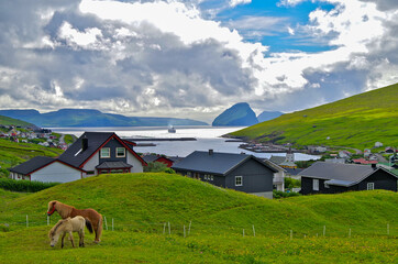 Breathtaking volcanic natural and nature landscape scenery on Faroe Islands with cruiseship or...