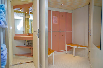View into locker or male changing room inside thermal suite spa wellness area on classic dated old...