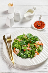 Salad of microgreen with avocado, shrimps, spinach