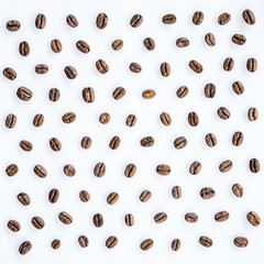 Pattern of roasted coffee beans arrange on white background