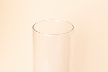 glass transparent vase on a beige background