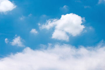 Naklejka na ściany i meble Clouds on bright blue sky and space background