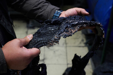 One of the first stages of production of rubber products at the plant. Close-up of raw material...