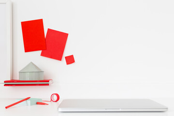 Workspace with red notes and office supplies at workplace. Creative home office.