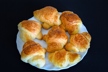 Fresh and delicious mini croissant isolated on white