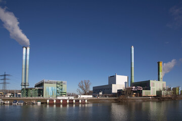 power station industry area with silos and tanks at the rhine harbor in Mainz-Mombach, Germany.