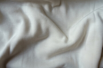 Simple white cotton jersey fabric in soft folds