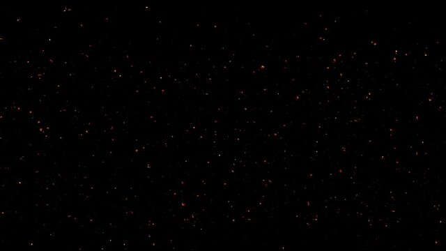 Small burning ash flies towards camera on black background. With alpha mask. 4K,ultra high definition 2160p