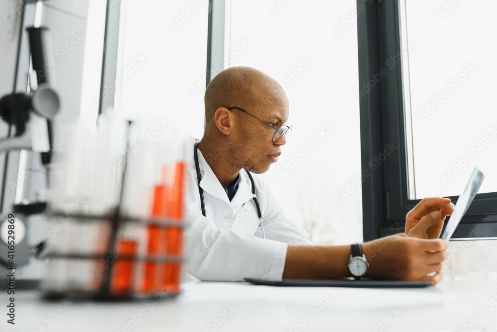 Wall mural african american man male hospital doctor in white coat with stethoscope