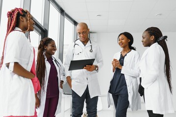 group of african american doctor and nurse in hospital ward