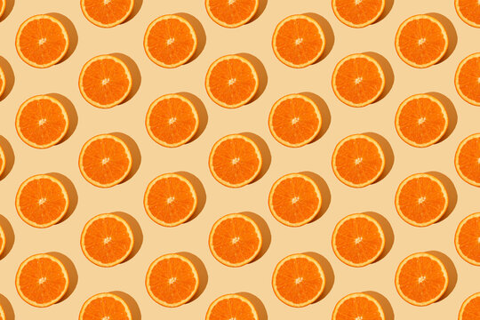Monochromatic creative pattern made of fresh orange. Juicy citrus pastel background. Minimal concept