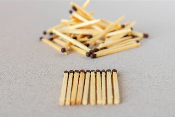 Lots of matches on a light background. The concept of chaos and order. Selective focus.