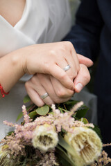 bride and groom holding hands