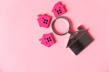 colorful wooden houses on pink , the concept of finance concept