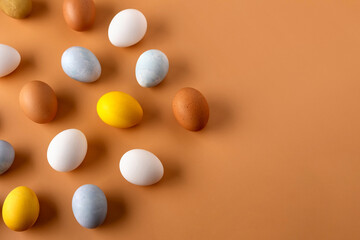 Naturally dyed easter eggs on beige background. Eco concept. Organic natural easter concept.