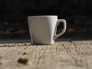 coffee mug on the cement floor