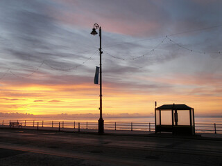 Fototapeta na wymiar Early morning sunrise showing deserted bus stop 