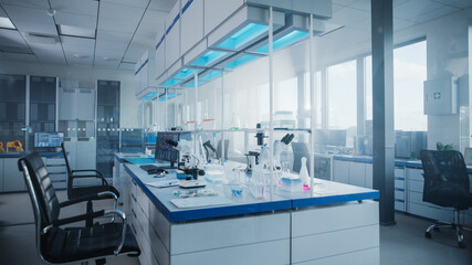 Modern Medical Research Laboratory with Computer, Microscope, Glassware with Biochemicals on the...