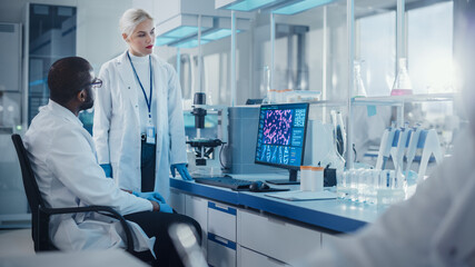 Modern Medical Research Laboratory: Two Scientists Use Computer with Screen Showing DNA Gene...