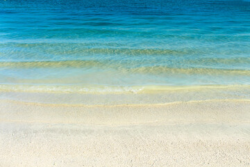 Fototapeta na wymiar Water nature background. Blue sea ocean calm water in tropical summer sandy beach seascape.