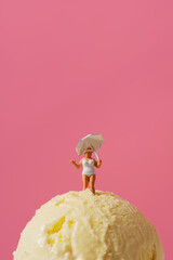 miniature lady on a vanilla ice cream ball