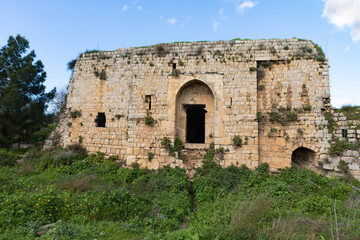 Fototapeta na wymiar The main entrance to the ruins of crusader Fortress Chateau Neuf - Metsudat Hunin is located at the entrance to the Israeli Margaliot village in the Upper Galilee in northern Israel