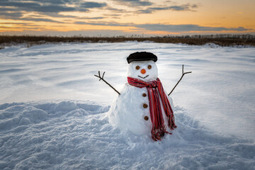 funny snowman at sunset