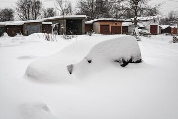 the car covered with snow
