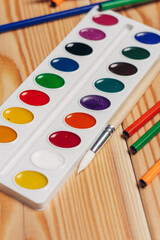 Obraz na płótnie Canvas multicolored paint brushes school drawing objects desktop