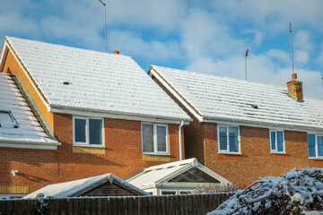 Snow covered new built house roof in england uk