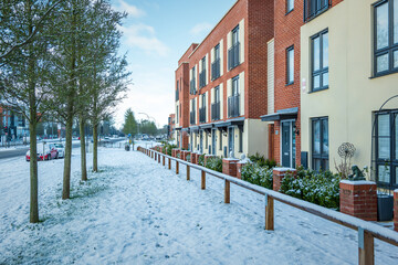 New built terraced houses under snow in england uk