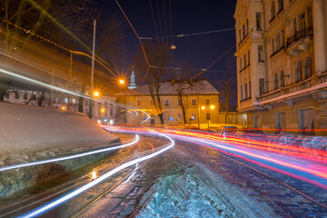 Night Lviv old city architecture in the winter season. Buildings highlighted by the illumination