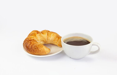 A cup of hot coffee and croissant on white plate isolated on white background with clipping path