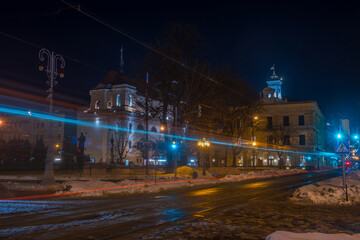 Fototapeta premium Night Lviv old city architecture in the winter season. Buildings highlighted by the illumination