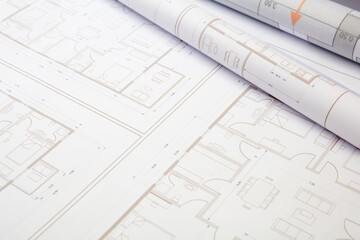 Construction concept. Residential building drawings on an office desk