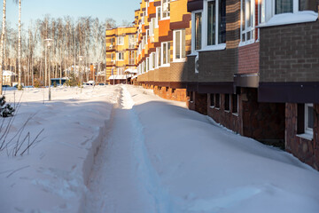 Moscow. Russia. February 2021. Cleared the snow from the paths after a huge snowfall. Deep walking paths in Moscow.