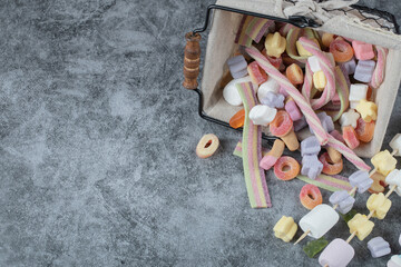 Multicolor yummy marshmallows in a mini metallic basket