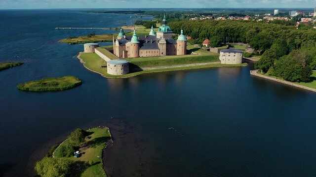 Aerial view of an old 1200 century castle fortress historical place battles war ships knights kings queens ruler European travel destinations canon ship war army fortified retro Scandinavian prisoner