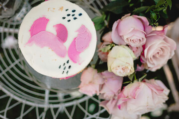 Obraz na płótnie Canvas Small wedding cake with pink floral frosting