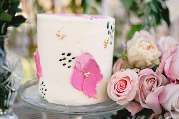 Small wedding cake with pink floral frosting