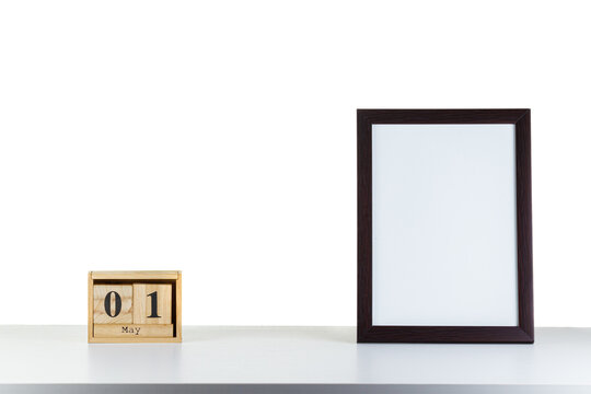 Wooden calendar 01 may with frame for photo on white table and background