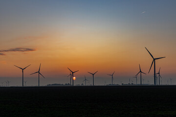 wind turbines at sunset