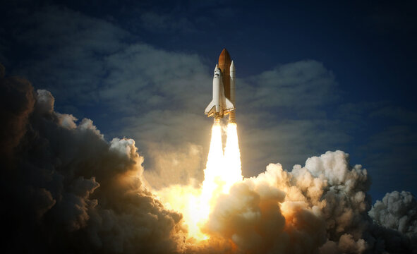 Space Shuttle takes off into space. Elements of this image furnished by NASA.