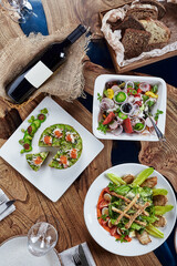 Beautifully decorated catering banquet table with different food snacks and appetizers