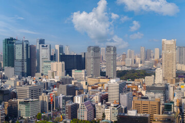 Fototapeta na wymiar Landscape of tokyo city skyline in Aerial view with skyscraper, modern office building and blue sky background in Tokyo metropolis, Japan.