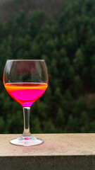 glass with new post covid drink with strong fluor color