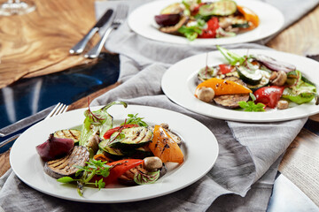 Grilled vegetables on a white plates. restaurant