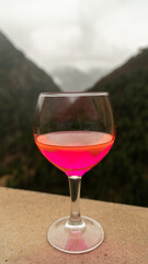 glass with new post covid drink with strong fluor color