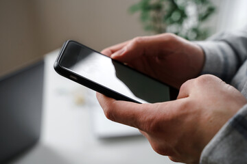 Close-up of a man using a mobile phone